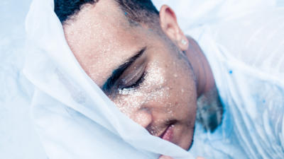 man's face covered in glitter